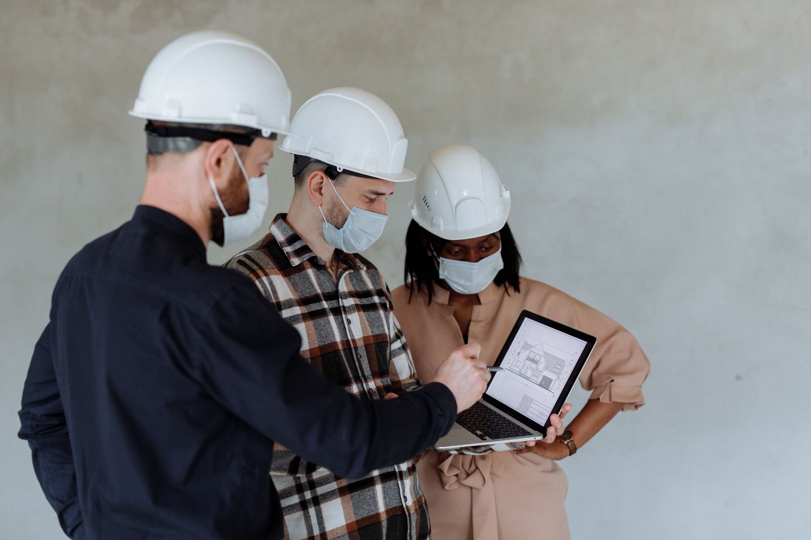 Engineers reviewing system performance on a site control screen